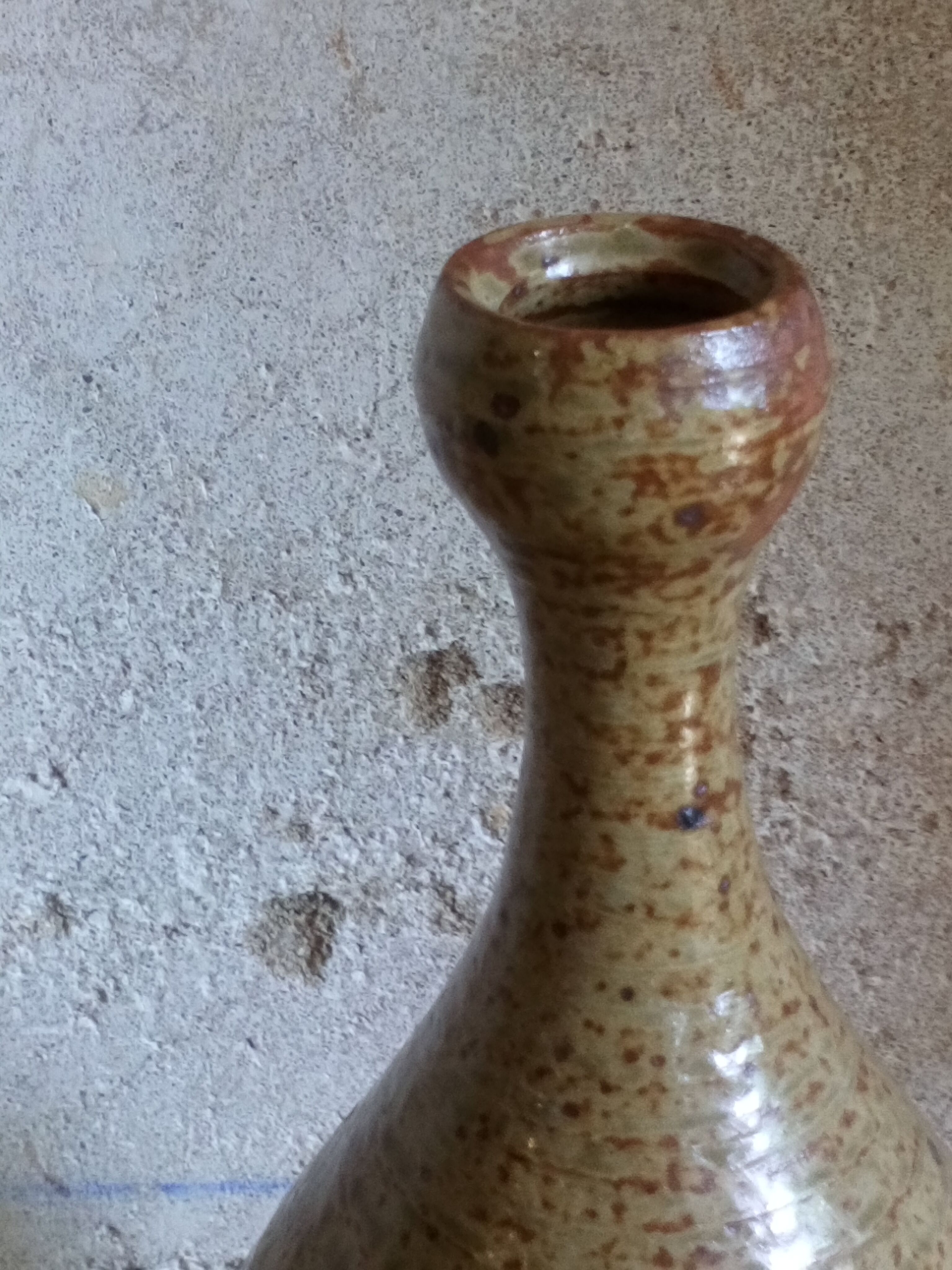 Bottled sandstone vase with a narrow neck