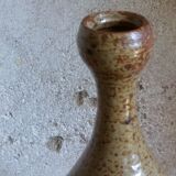 Bottled sandstone vase with a narrow neck