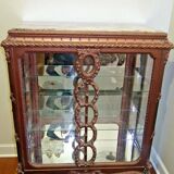 A Louis XV style display cabinet with three beechwood shelves and a white marble top.