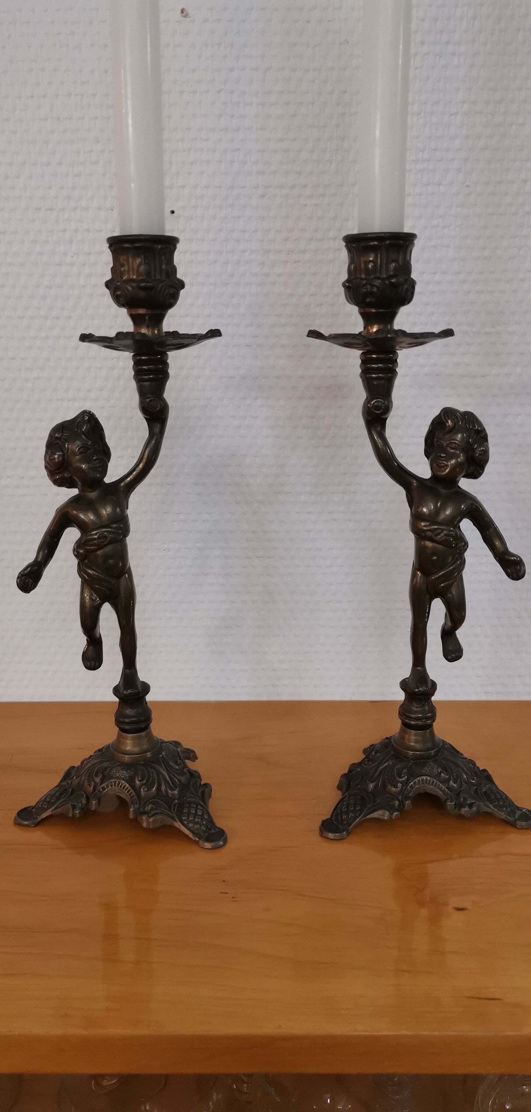 Pair of antique candlesticks in bronze and brass