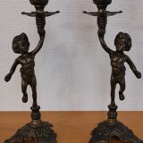 Pair of antique candlesticks in bronze and brass