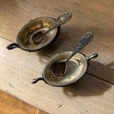 Salt and pepper shakers with silver spoons