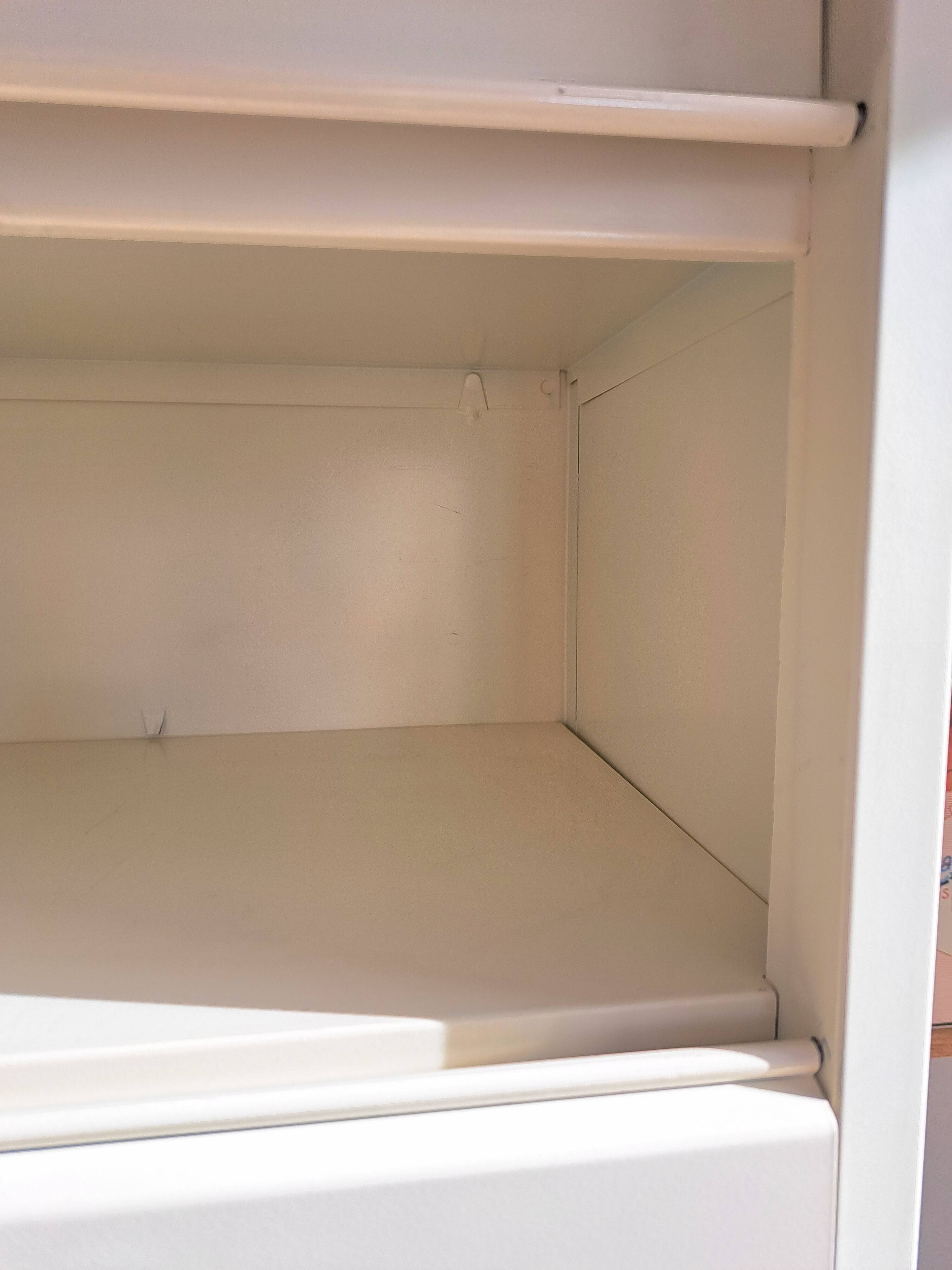 Vintage metal clamshell cabinet