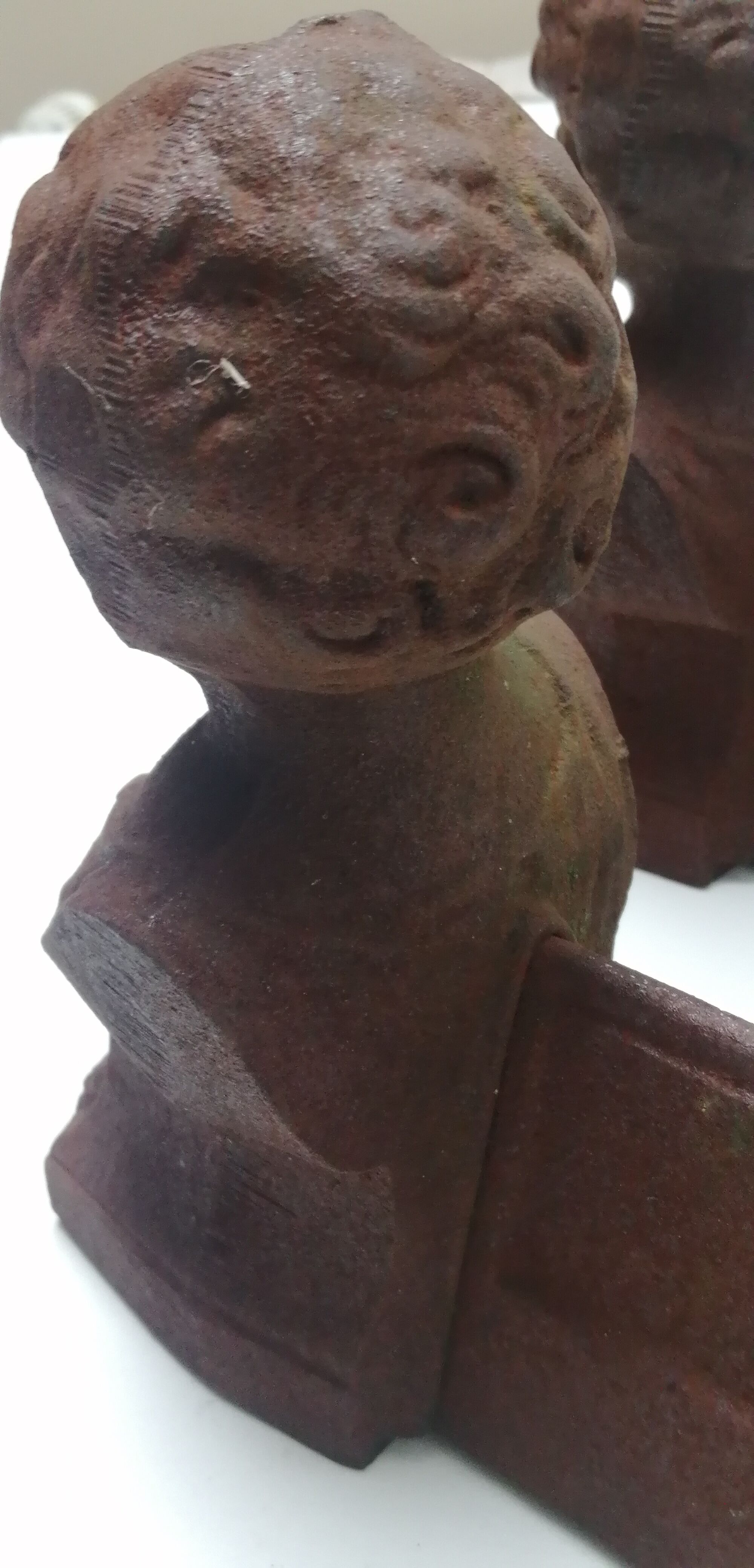 Pair of cast iron fireplace chenets "children"