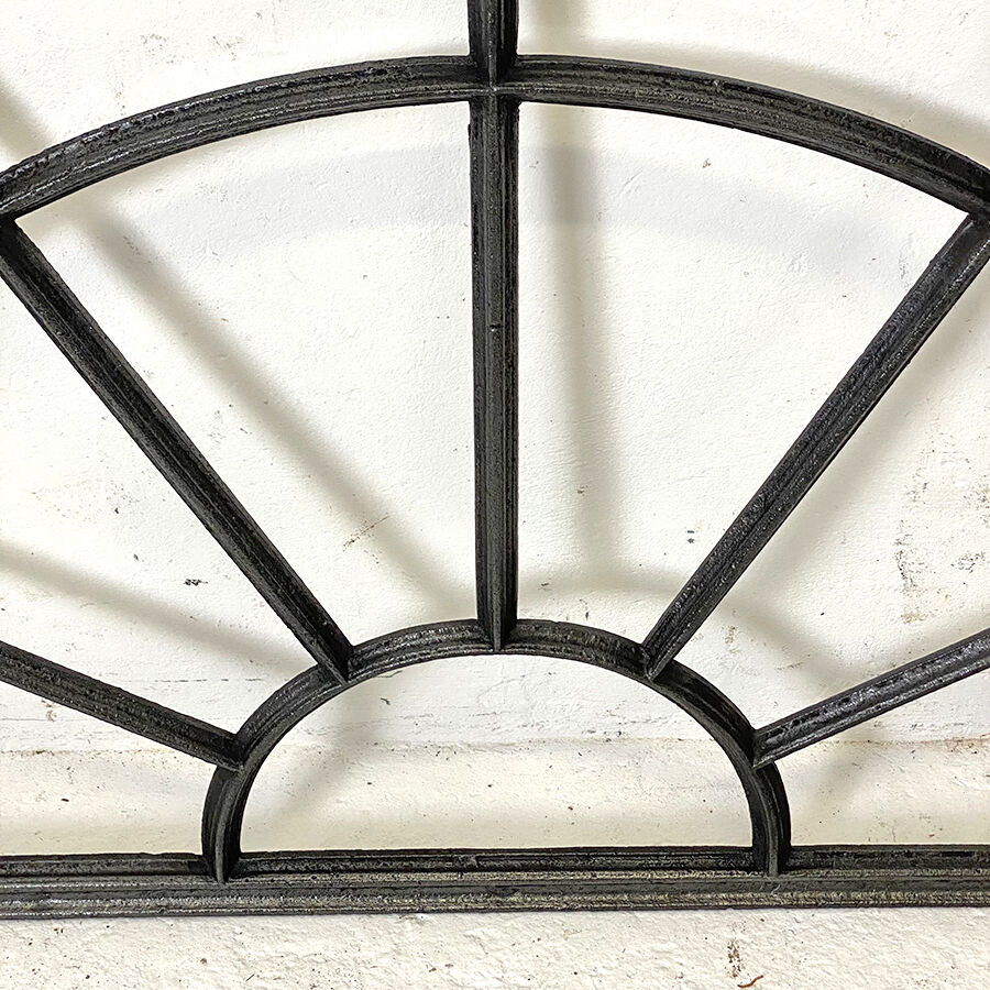 Old arched anthracite grey window