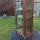Louis XV Rocaille style showcase in solid walnut, beveled door glass.