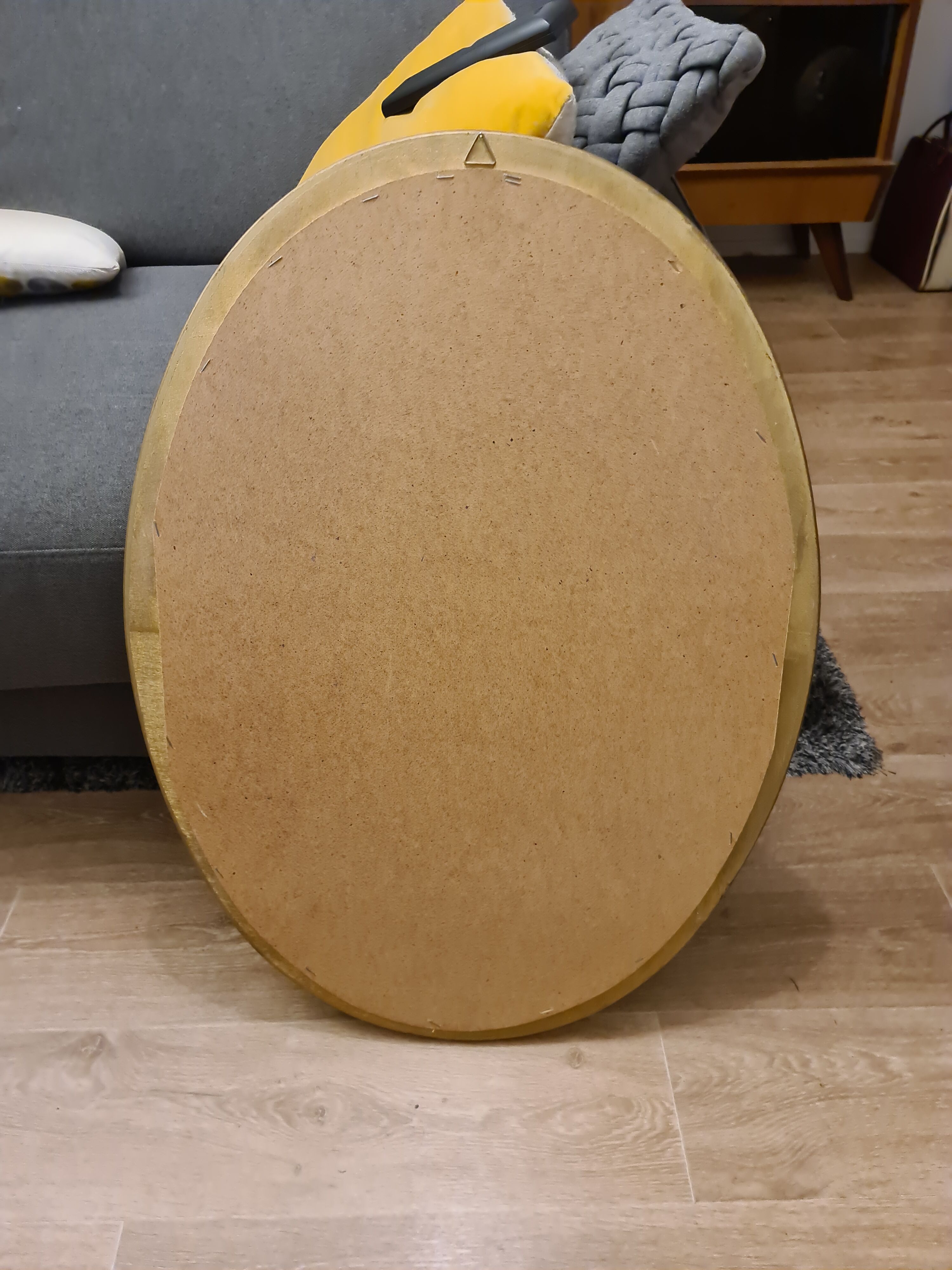 Beveled oval mirror in gilded wood 78×58cm