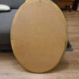 Beveled oval mirror in gilded wood 78×58cm