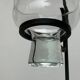 Mid-century metal and glass pendant light from the 1960s.