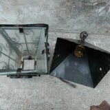 pair of wrought iron lanterns and granite glass