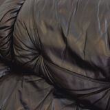 Vintage corner sofa composed of 3 modules in black leather with integrated bed.