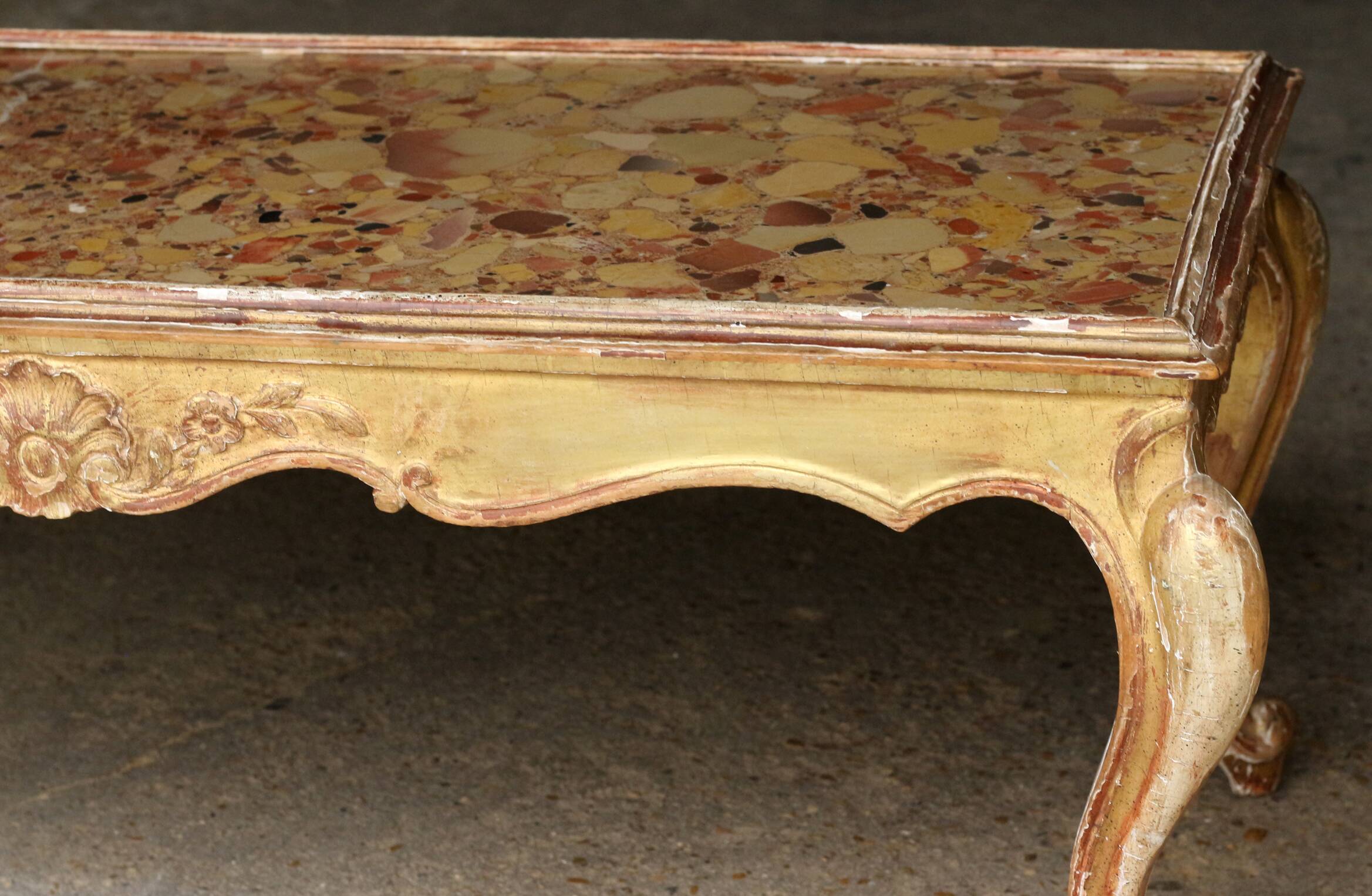 19th century coffee table. Gilded stucco and marble.
