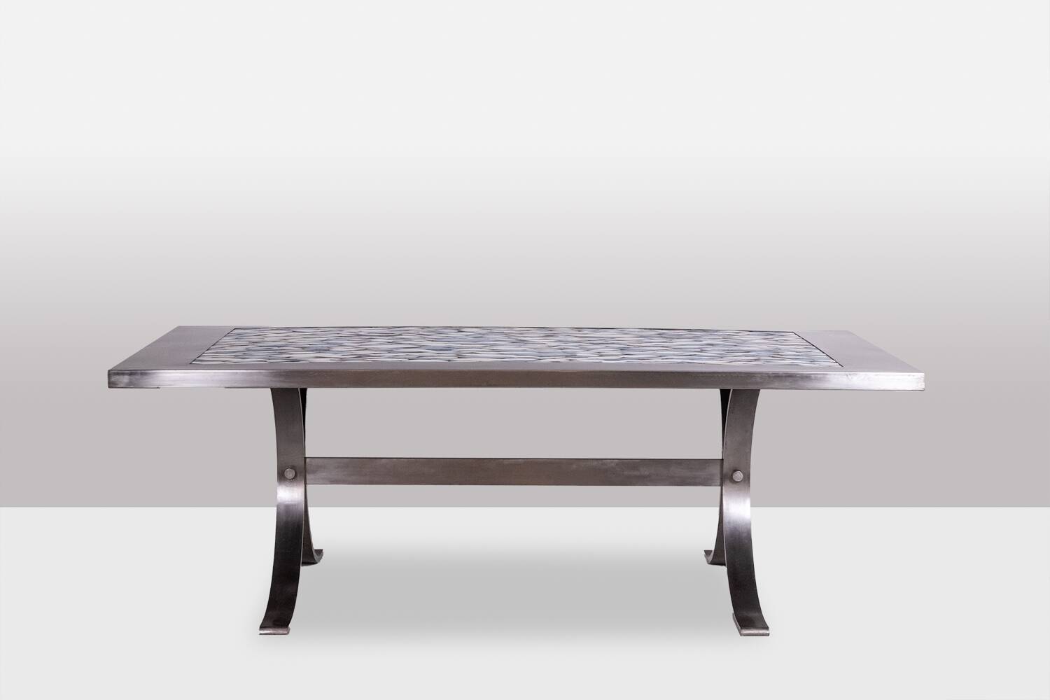 Polished metal and ceramic dining table. 1970s.