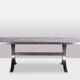 Polished metal and ceramic dining table. 1970s.