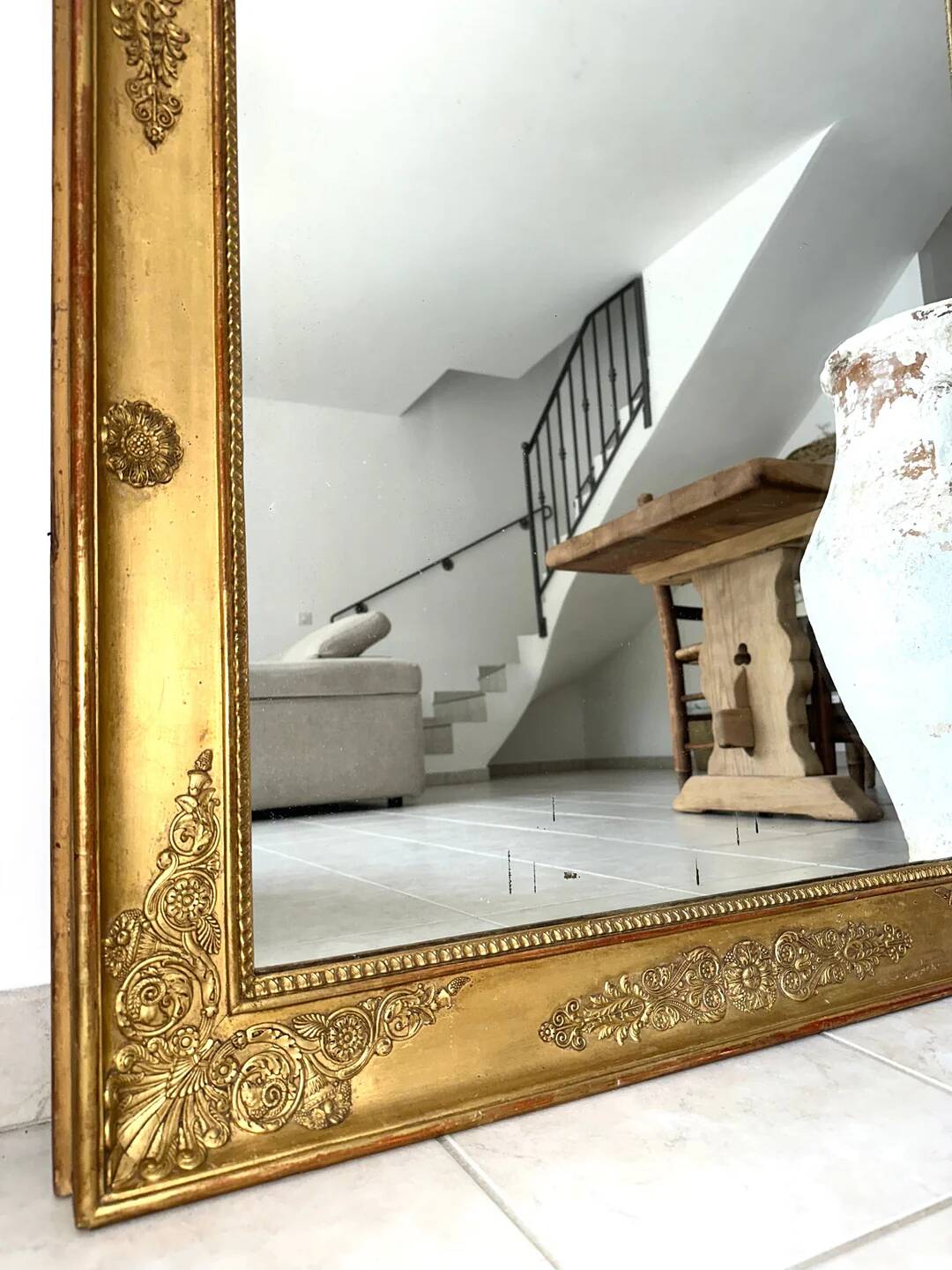 Antique gilded mirror from the Restoration period, 19th century.