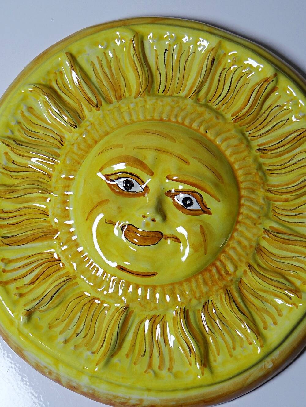 Vintage handcrafted anthropomorphic sun wall plaque in Vietri majolica.