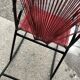 Vintage red metal rocking chair, graphic plastic cord with fan backrest, 1960s.