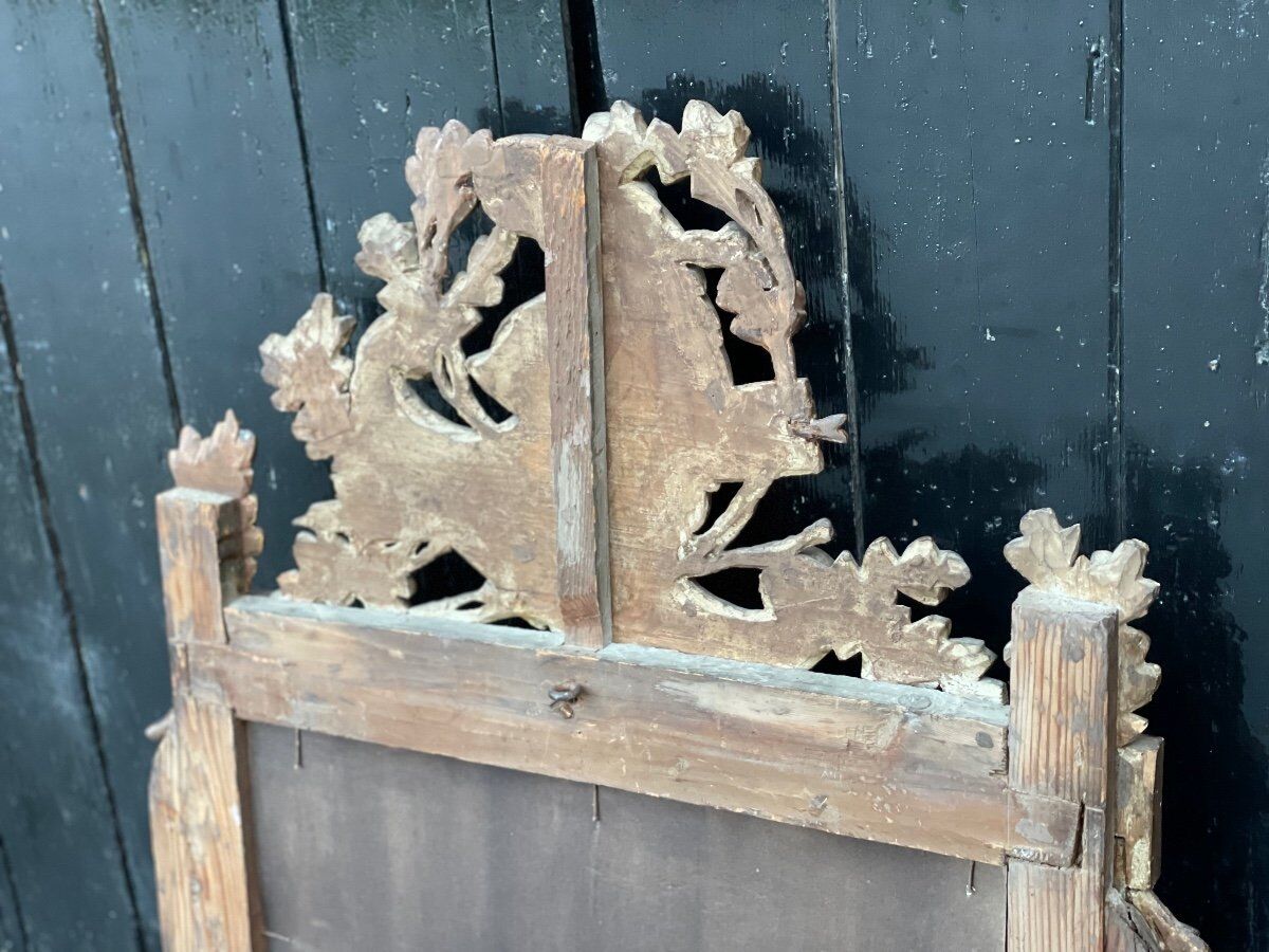 Louis XVI mirror in gilded carved wood, eighteenth century