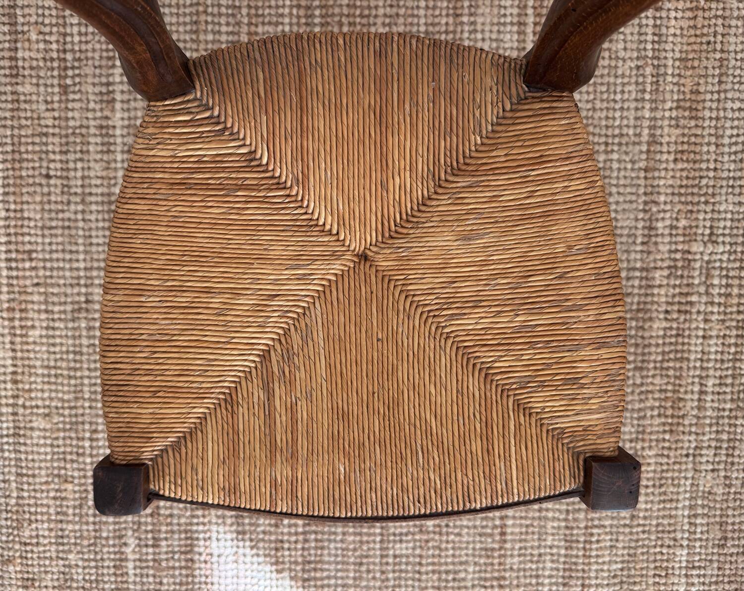 Antique wooden chairs with rush seating.