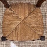 Antique wooden chairs with rush seating.