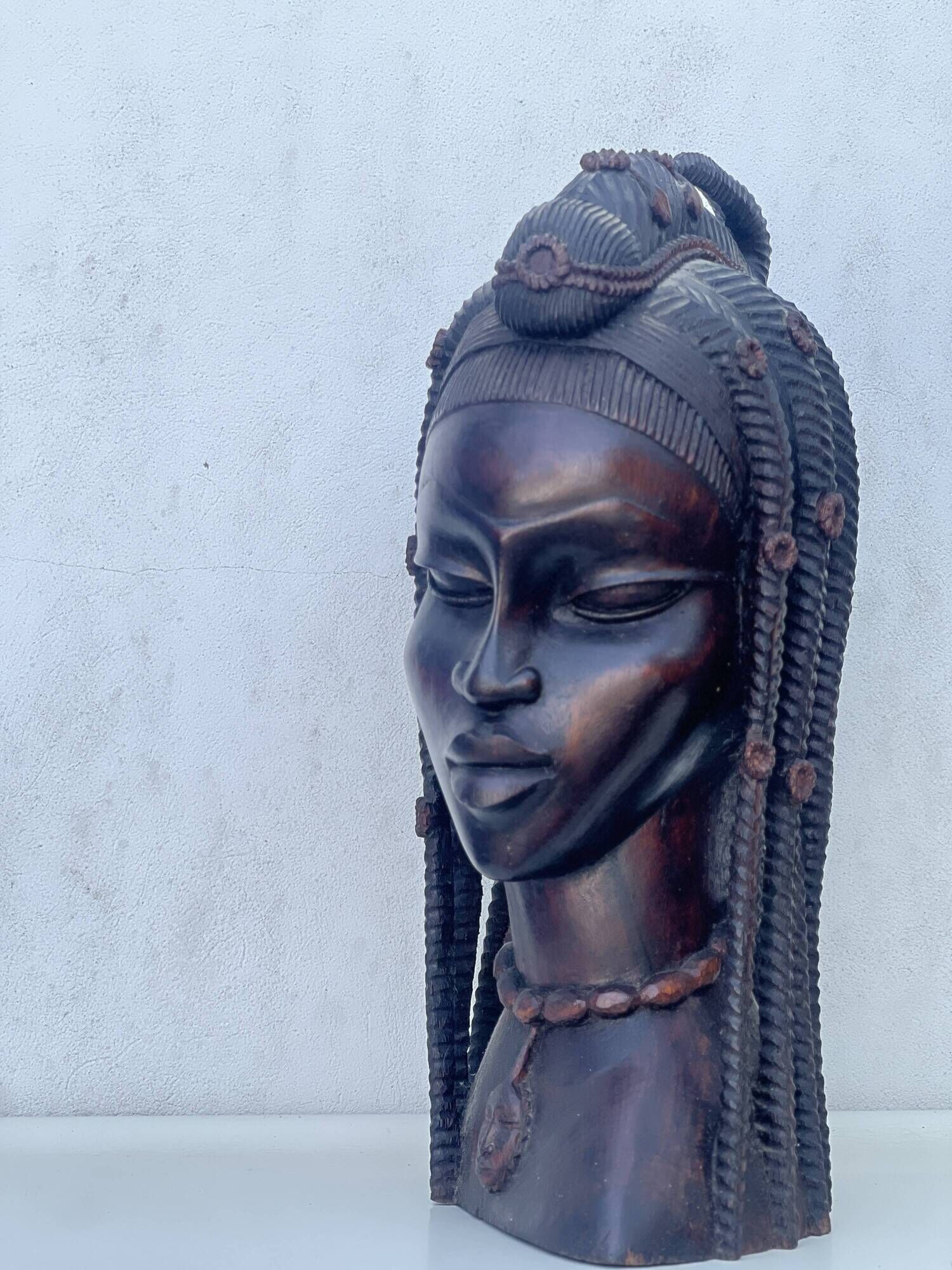 Large wooden bust of an African woman.