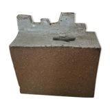Vase architecture in raw sandstone.