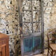 Old glazed wooden door patinated
