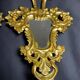 Pair of carved and gilded wooden mirrors, Italian Baroque style, 19th century.