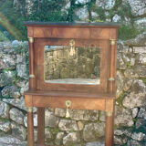 A small piece of Bonheur du jour with detached columns in Empire-era mahogany.