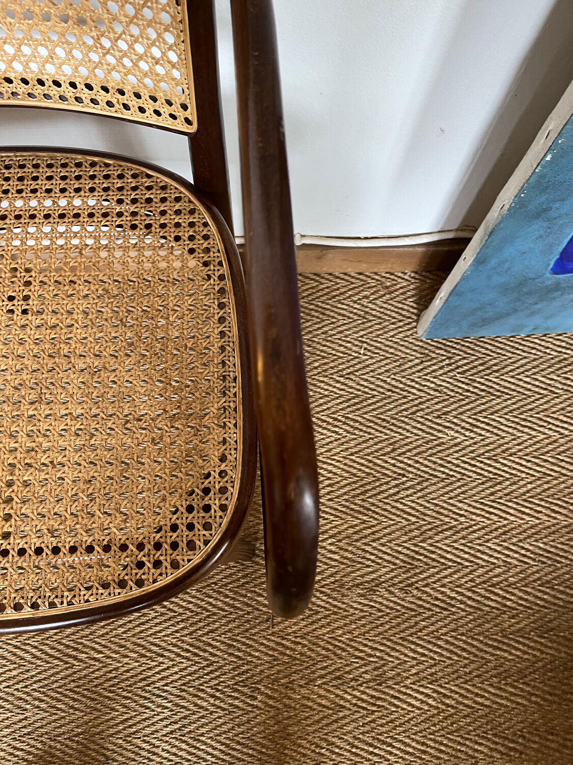 Curved wood and cane armchair