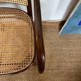 Curved wood and cane armchair