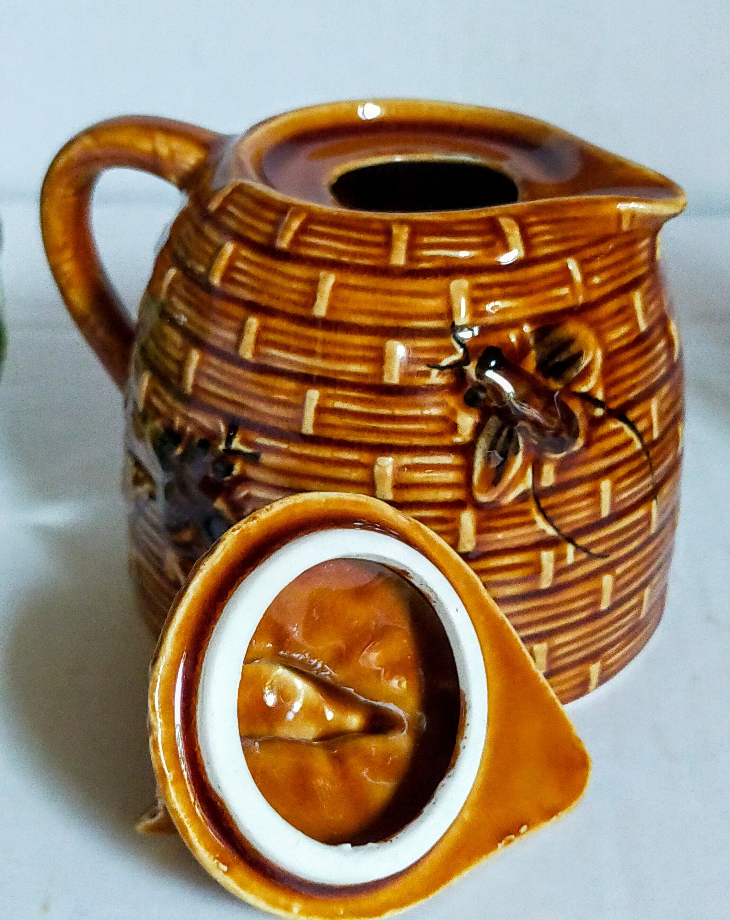 Set of old teapots and honey pot