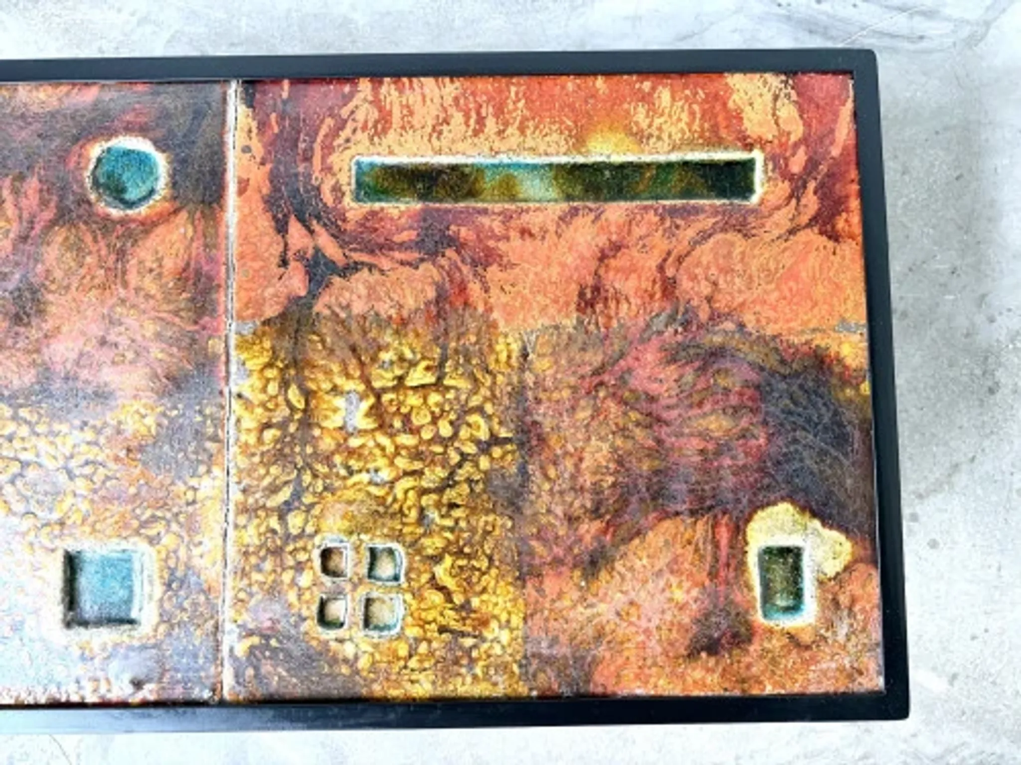 Coffee table by Robert and Jean Cloutier in enamelled lava and metal, 1950s.