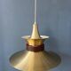 Large UFO flying saucer pendant light with orange light.