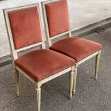 2 Louis XVI chairs in solid wood and orange velvet.