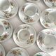 12 ironstone coffee cups with polychrome floral decoration, KG Lunéville