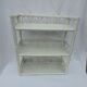 White rattan wall shelf