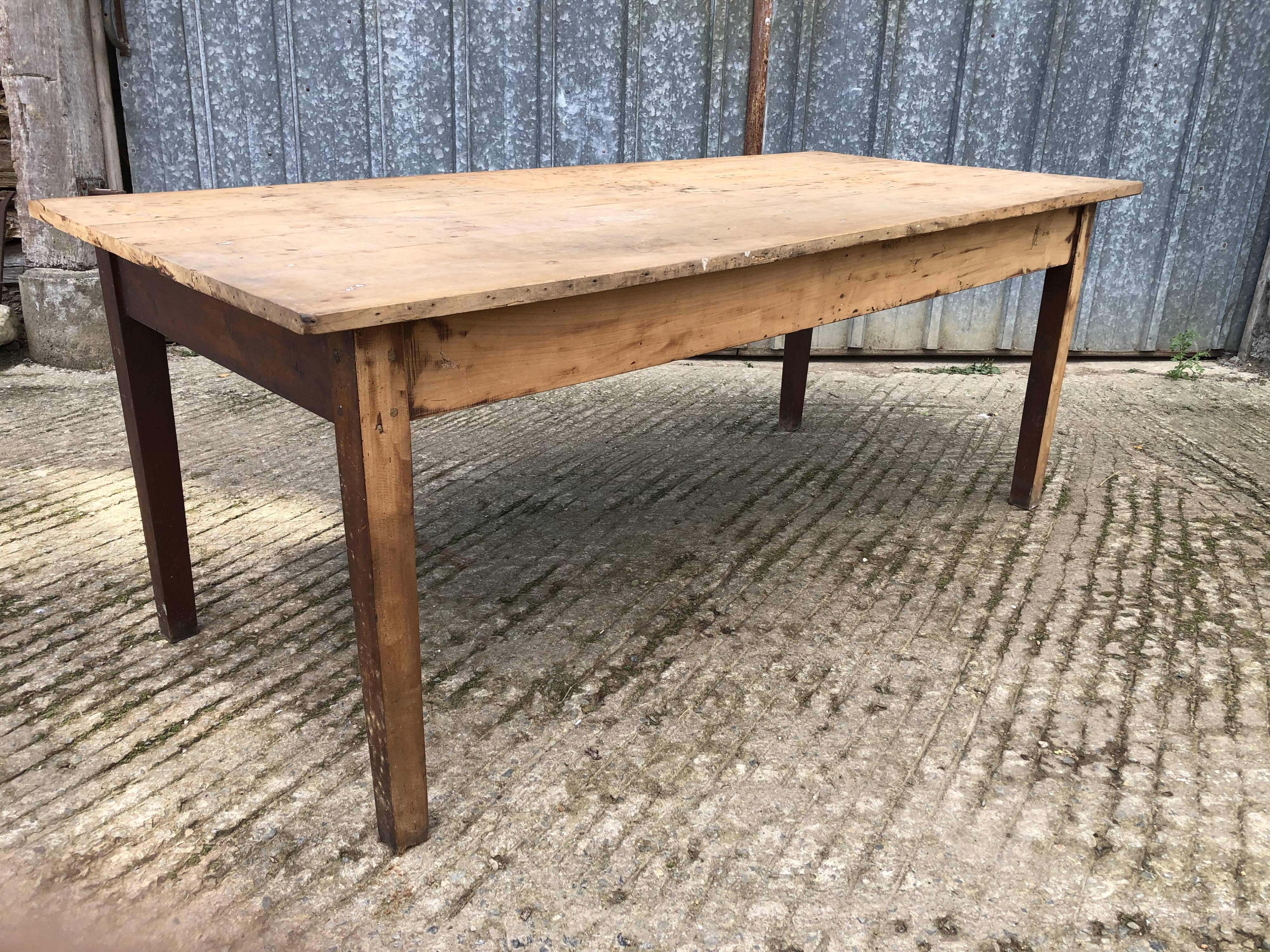 Rustic antique farmhouse table in solid cherry wood.