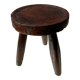 Tabouret en bois massif brun assise circulaire creuse