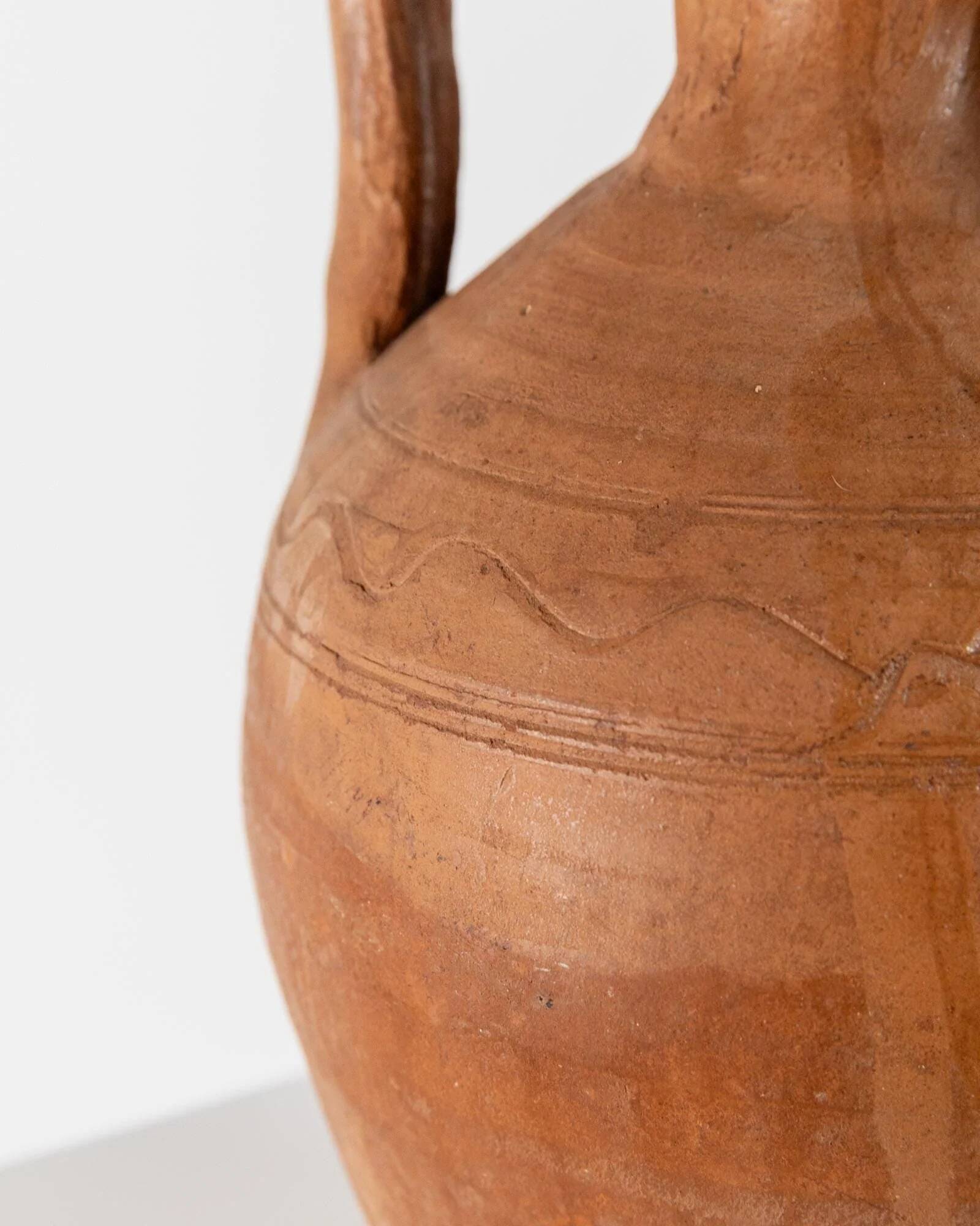 Vintage terracotta amphora vase from the early 19th century, handmade Italian jug with two handles.