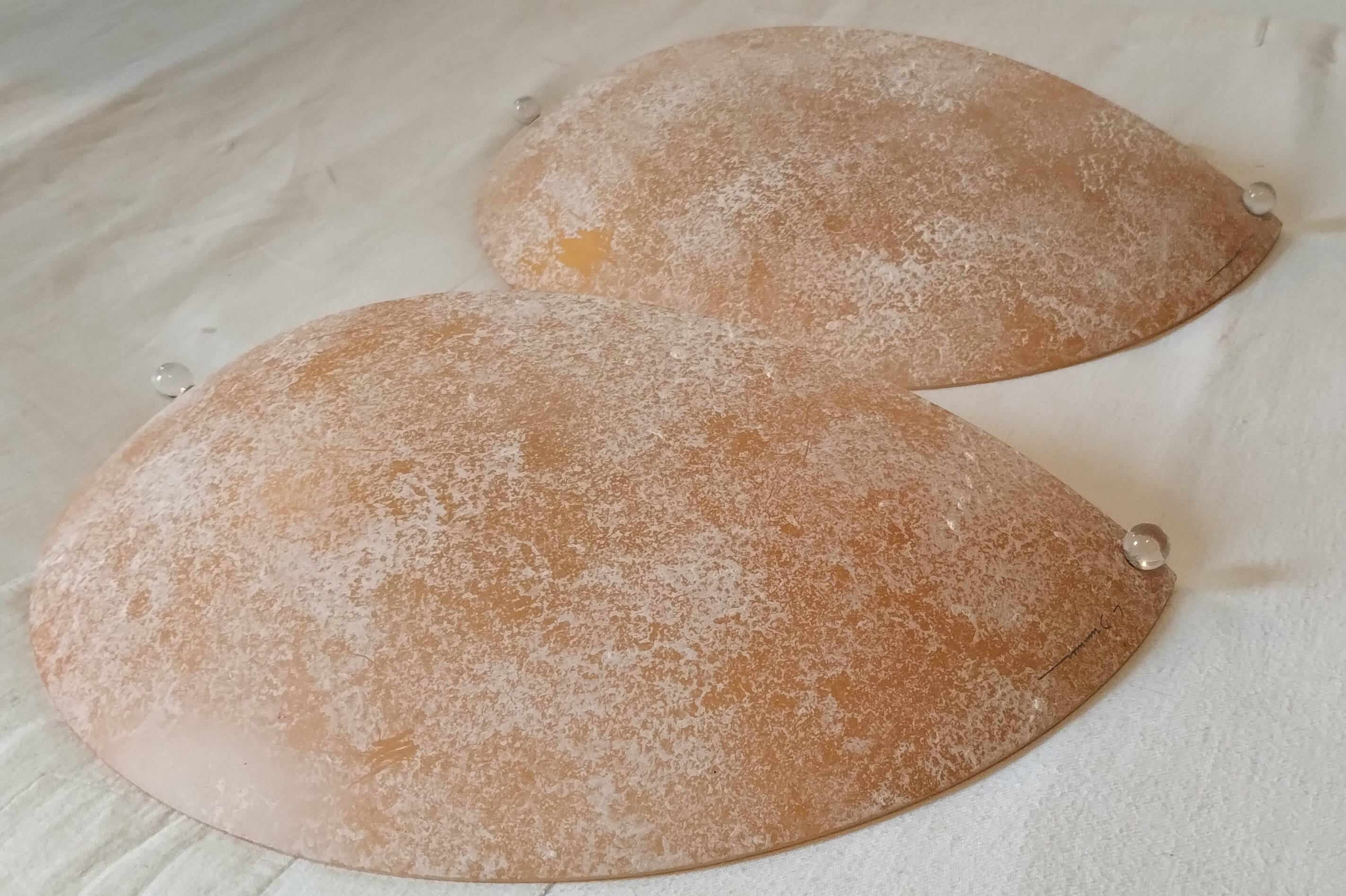 Pair of wall sconces signed L. Drummer