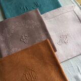 Set of four old damask towels tinted in multiple colors