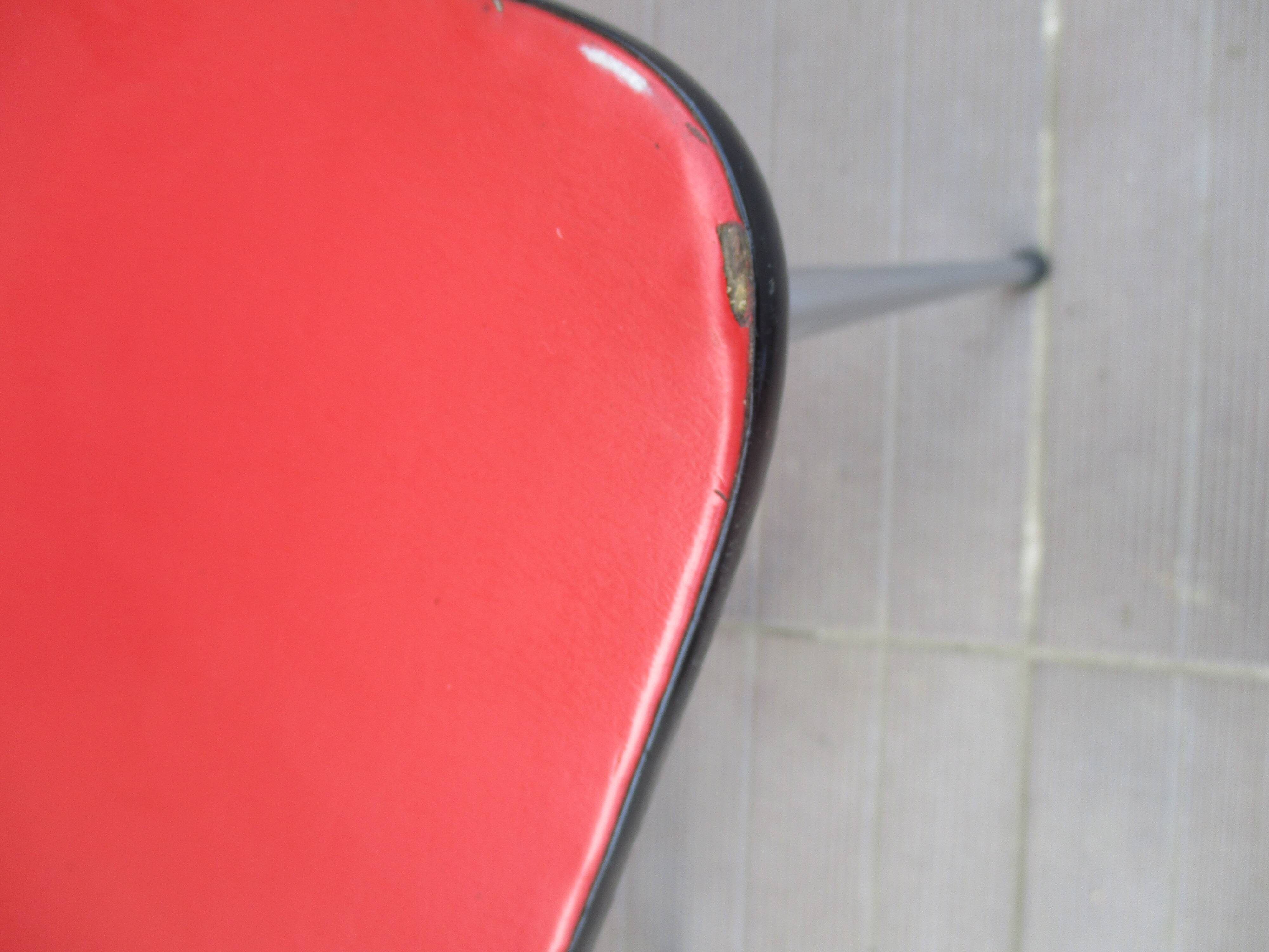 2 red chairs vintage