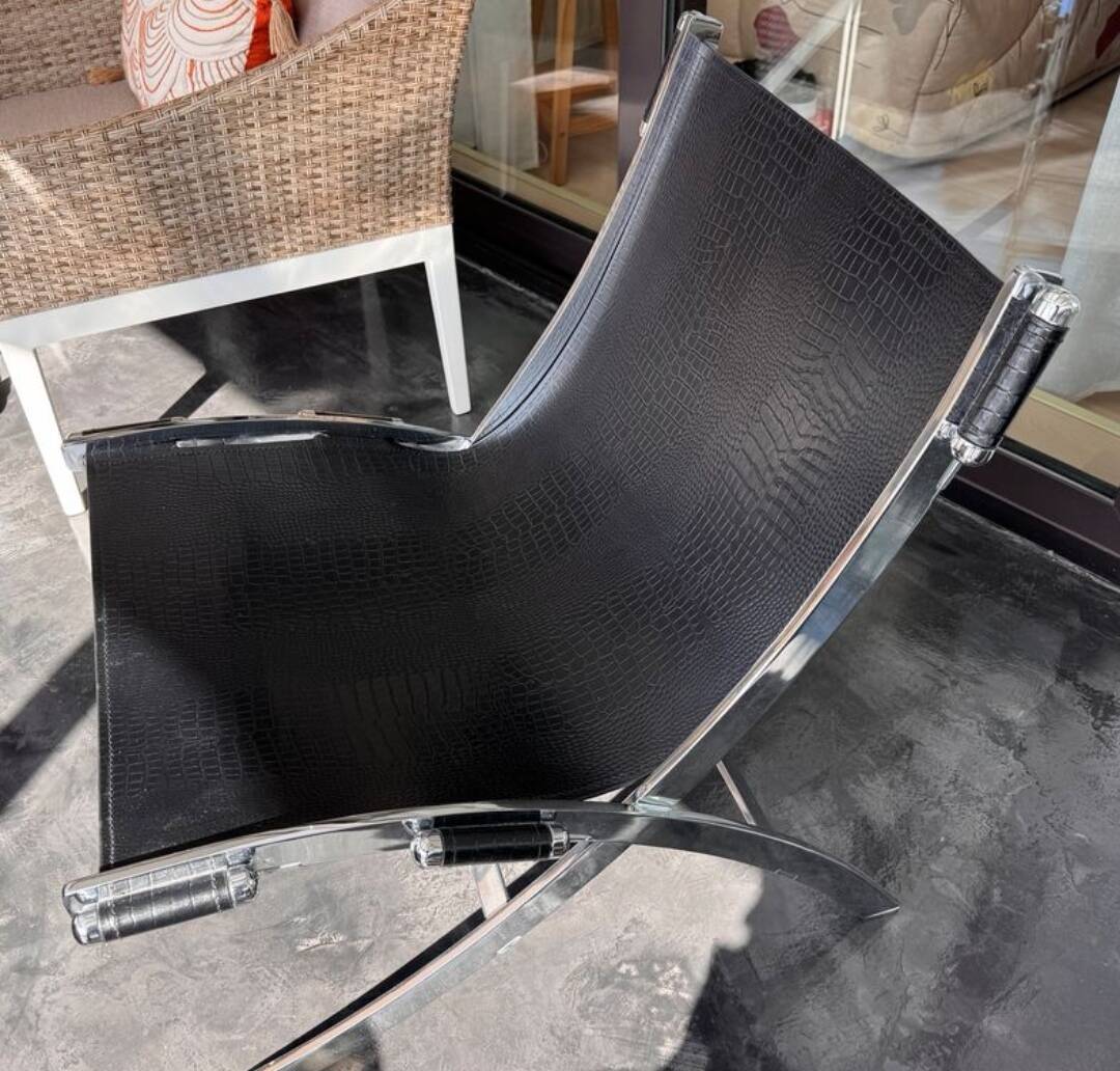 ILVA Cuba model armchair in black leather, Denmark, 2000s.