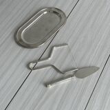 Foie gras set in shiny silver metal