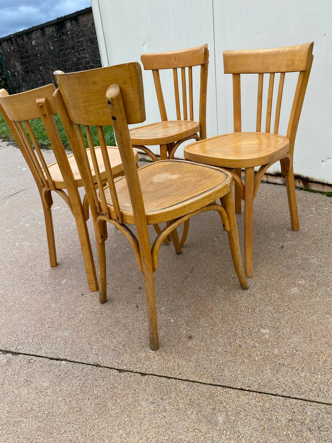 Curved varnished bistro chairs