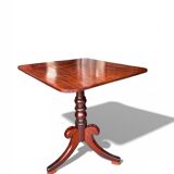 19th-century solid mahogany tilting table with a brass mechanism.