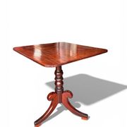 19th-century solid mahogany table with a tilting top and brass mechanism.