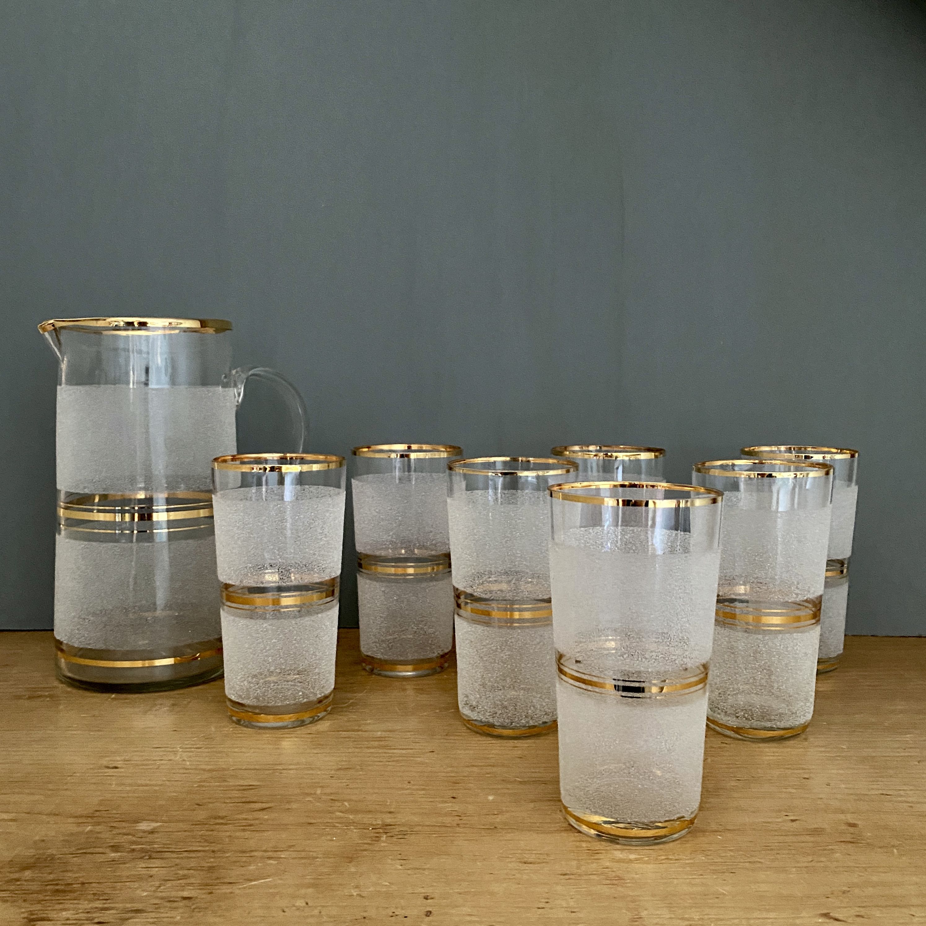 Vintage orangeade service in white granite glass and golden edging