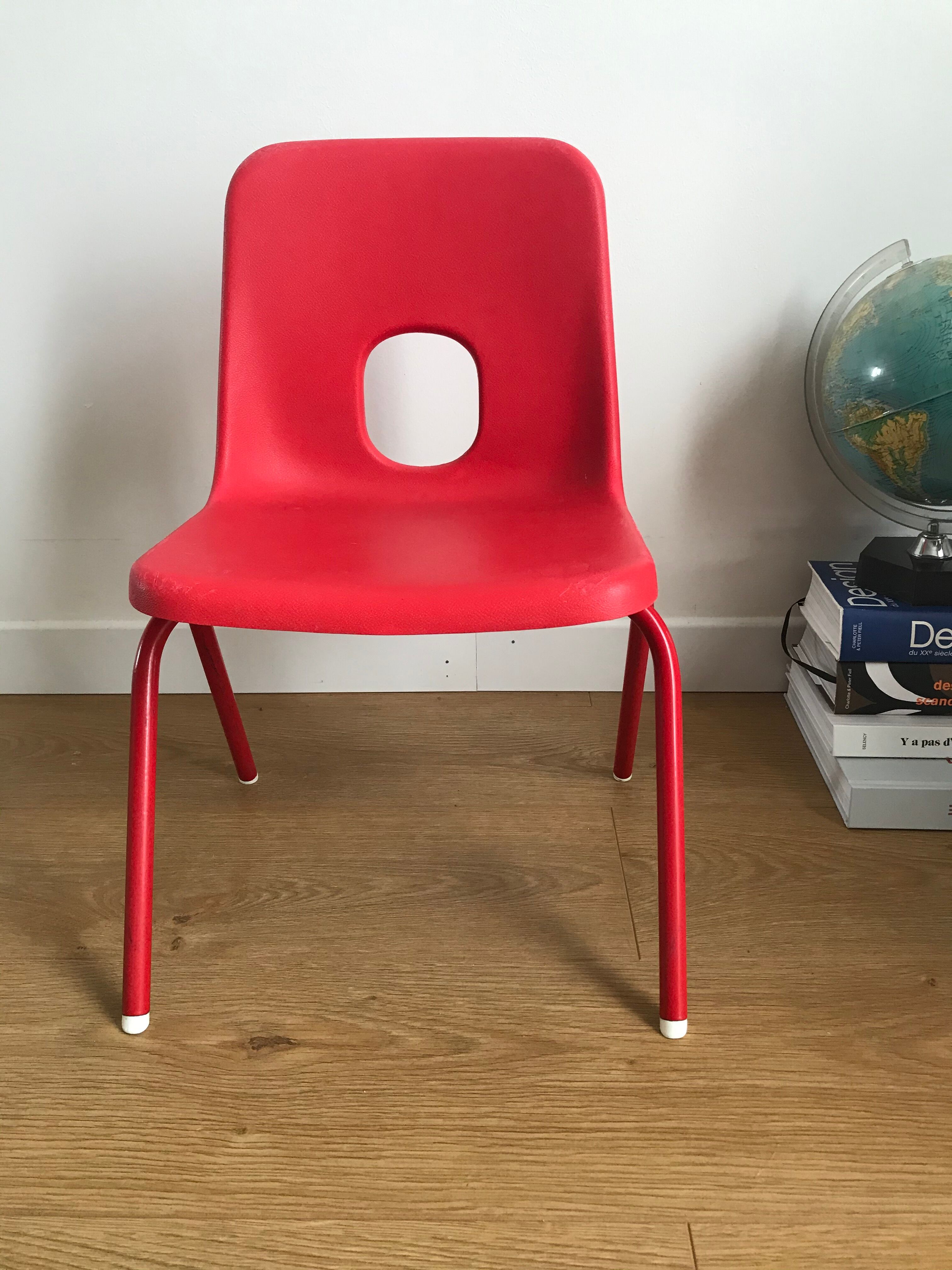 Red child chair by robin day for ikea